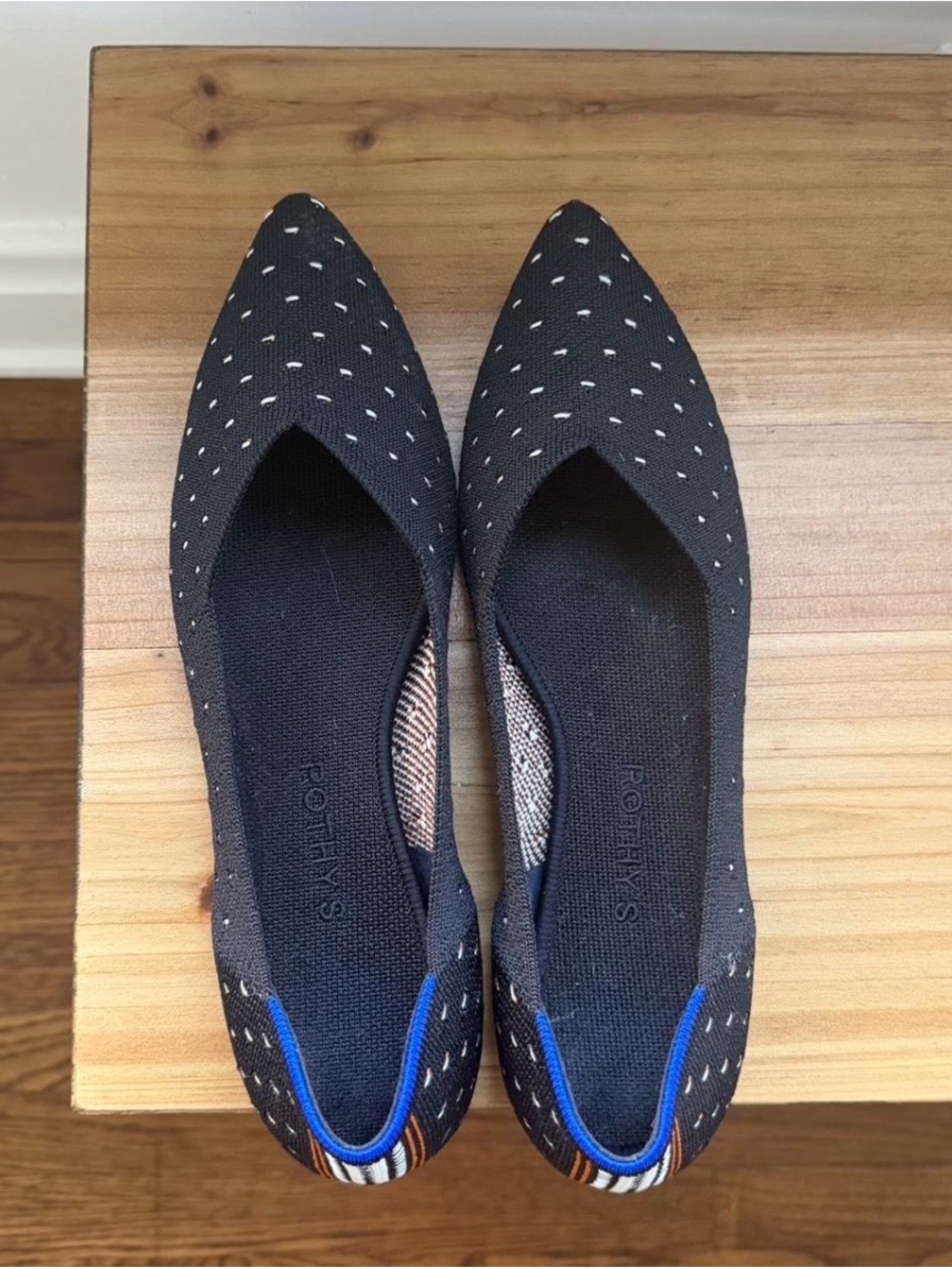 Rothy's Black Pointed Knit Flats with White Speckle and Blue Trim